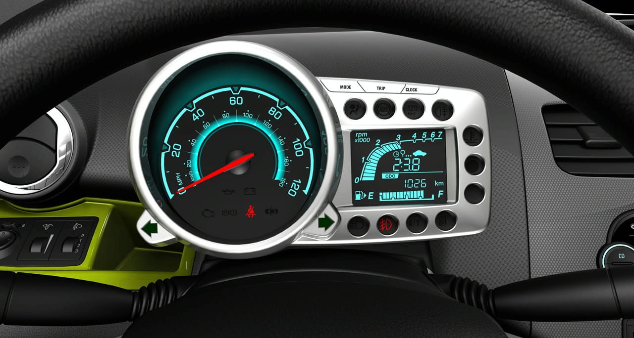 Acabados y detalles del interior del Chevrolet Spark, destacando el volante y la consola.