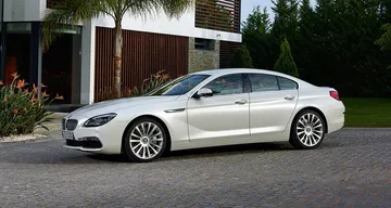 Vista lateral que muestra la elegancia y dinamismo del BMW Serie 6 Gran Coupé. Vista lateral que muestra la elegancia y dinamismo del BMW Serie 6 Gran Coupé.