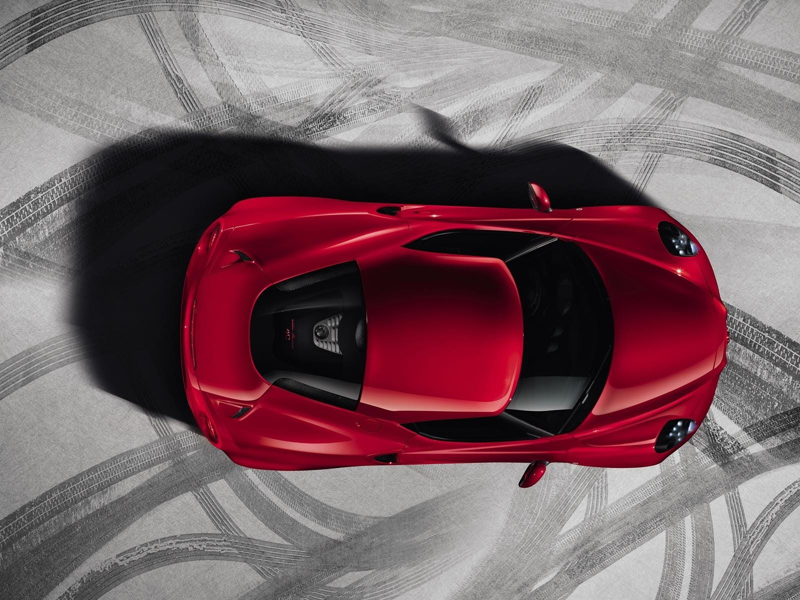 Vista aérea del Alfa Romeo 4C destacando su diseño de techo y líneas aerodinámicas.