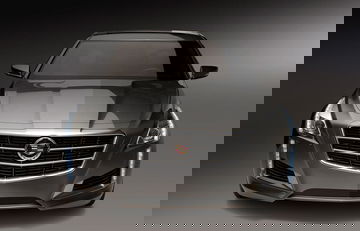 Vista frontal del Cadillac CTS destacando su parrilla y faros agresivos.