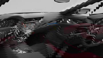 Vista del volante y consola central del Cadillac CTS, destacando su diseño elegante.