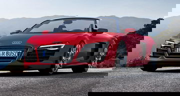 Vista frontal y lateral del Audi R8 Spyder en color rojo.