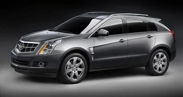 Vista lateral del Cadillac SRX destacando su diseño elegante y llantas distintivas.