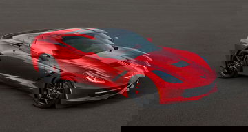 Vista lateral de un Corvette rojo destacando su diseño aerodinámico.