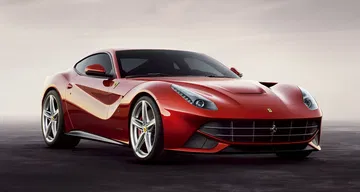 Vista lateral del Ferrari F12 Berlinetta, resaltando su diseño aerodinámico. Vista lateral del Ferrari F12 Berlinetta, resaltando su diseño aerodinámico.