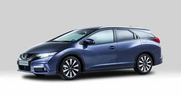 Vista lateral del Honda Civic Tourer que muestra su línea aerodinámica. Vista lateral del Honda Civic Tourer que muestra su línea aerodinámica.