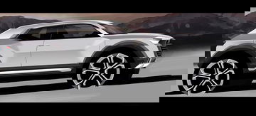 Vista lateral del Audi Q1 mostrando su línea deportiva y dinámica