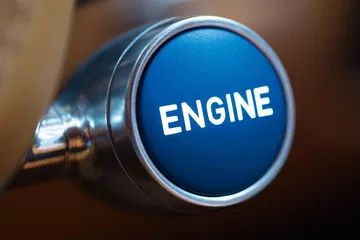 Botón de arranque del motor del Bugatti Chiron, destacando su diseño y elegancia