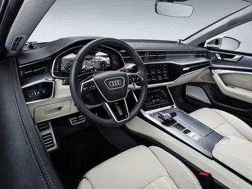 Vista de los asientos de cuero y el tablero de control sofisticado del Audi A7 Sportback.