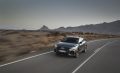 Vista lateral dinámica del Audi Q3 Sportback en carretera.