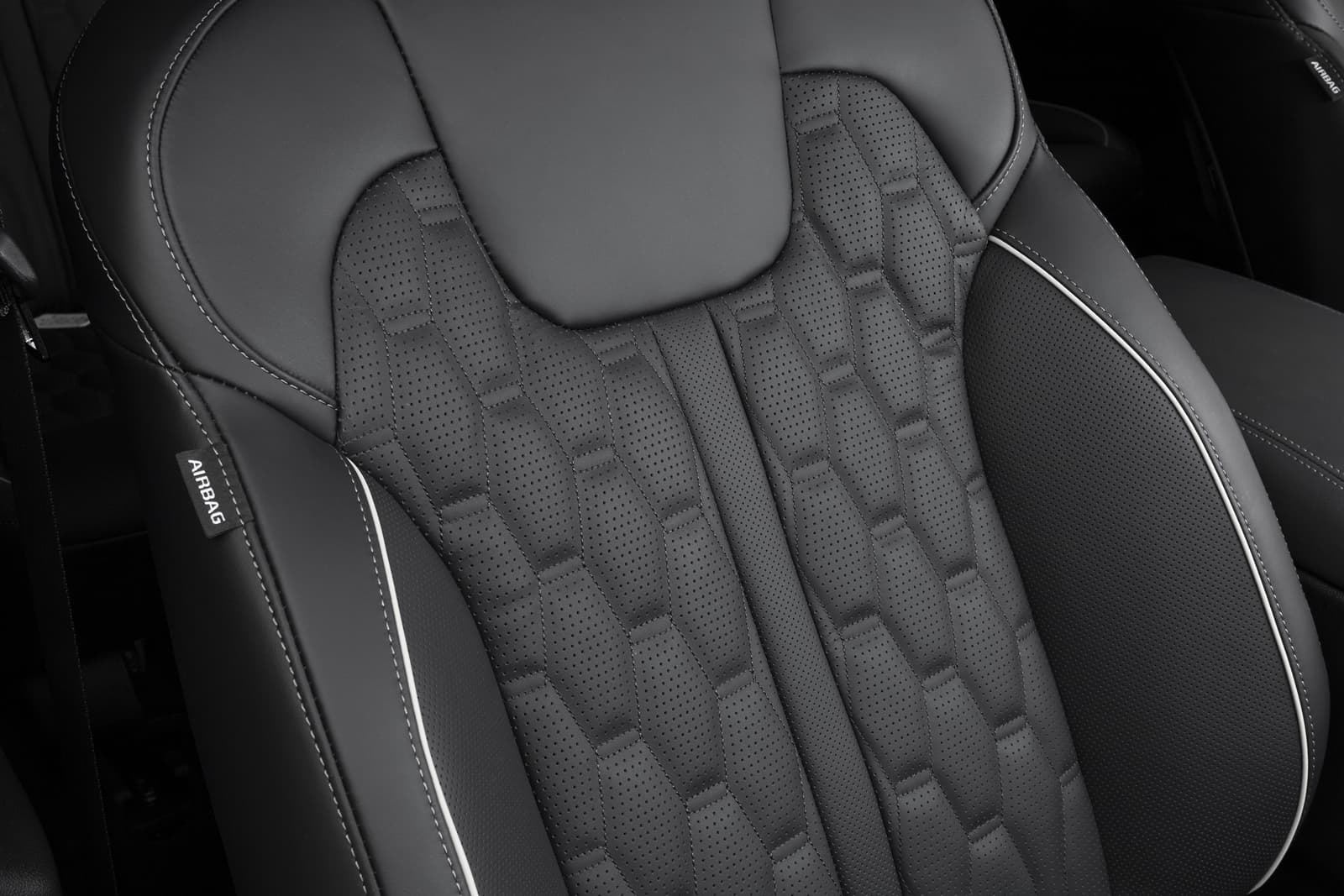 Vista cercana del acabado y textura del asiento del Kia Sorento.