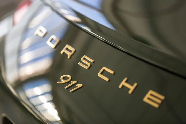 Investigacion Emesiones Porsche Gasolina 911 Logo