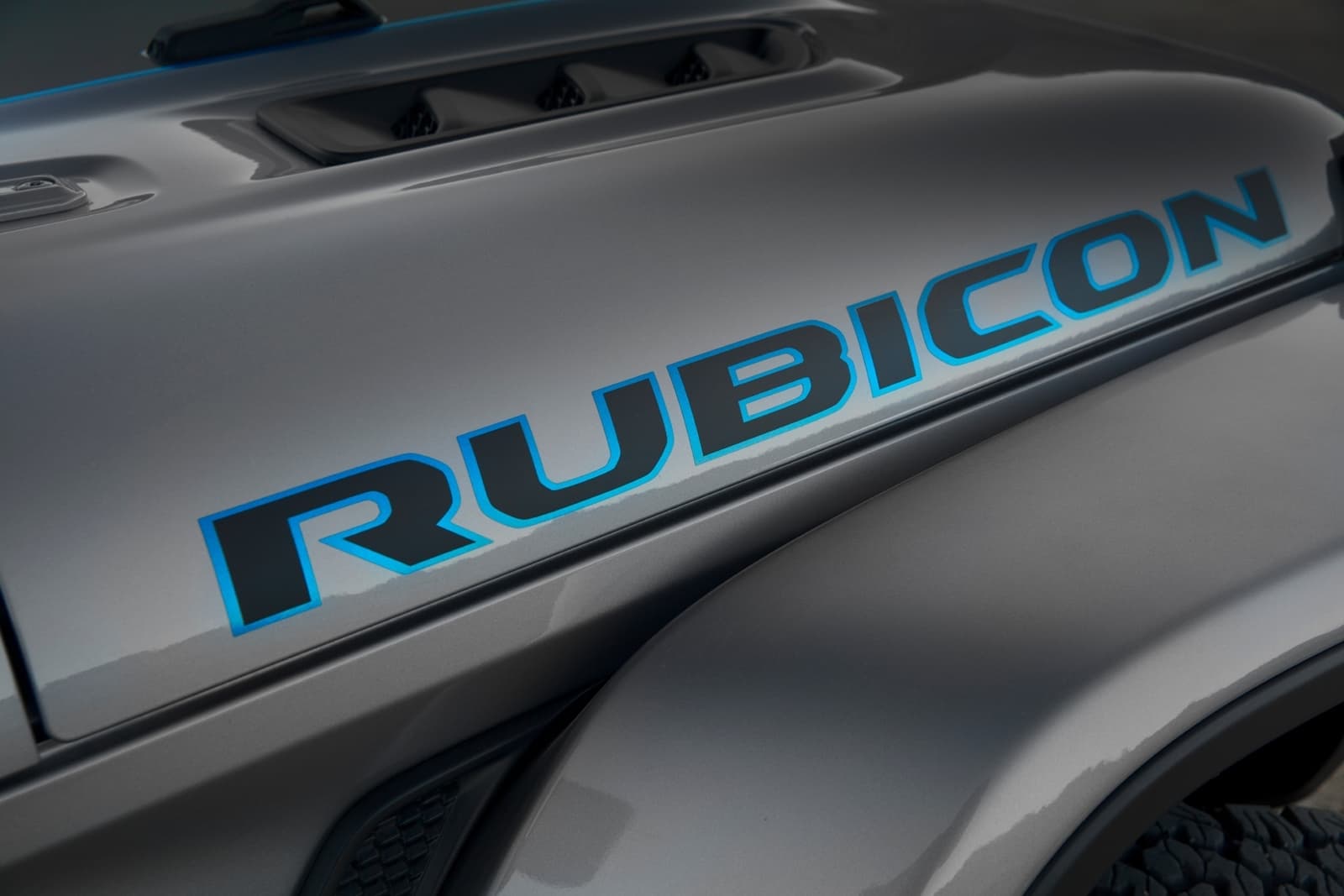 Surf Blue Accents The Rubicon Graphic On The Hood Of The 2021 Je