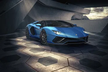 Vista dinámica del Lamborghini Aventador mostrando su agresiva delantera y línea lateral.
