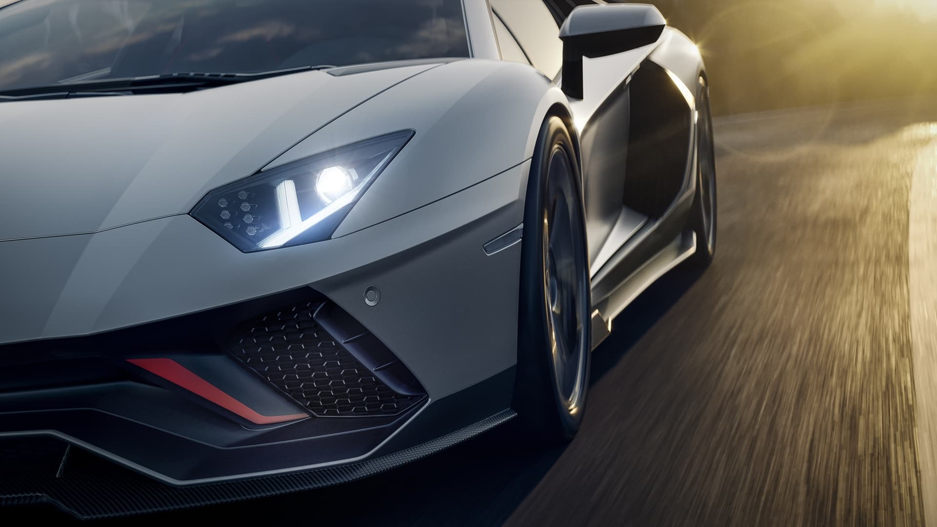 Fascinante ángulo del Aventador mostrando su agresiva línea frontal y lateral.