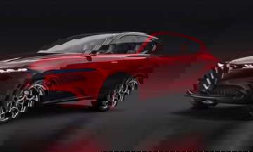Vista lateral del Alfa Romeo Brennero destacando su diseño deportivo.