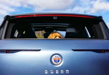 Fisker Ocean Big Sur Blue In Malibu House; Couple Inside