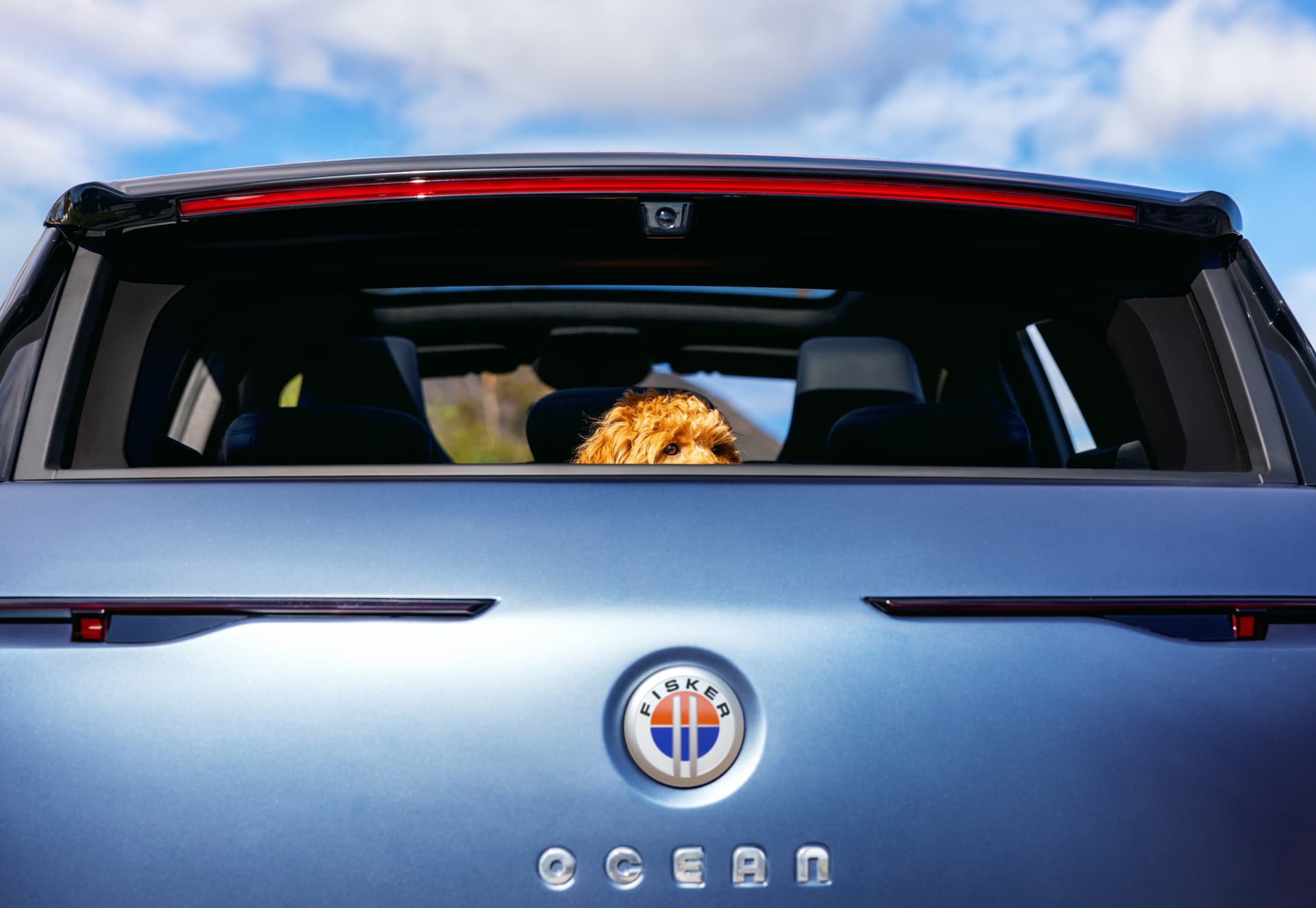 Fisker Ocean Big Sur Blue In Malibu House; Couple Inside