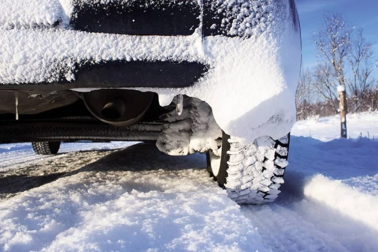 Closeup Of Car Tires In Winter Morning