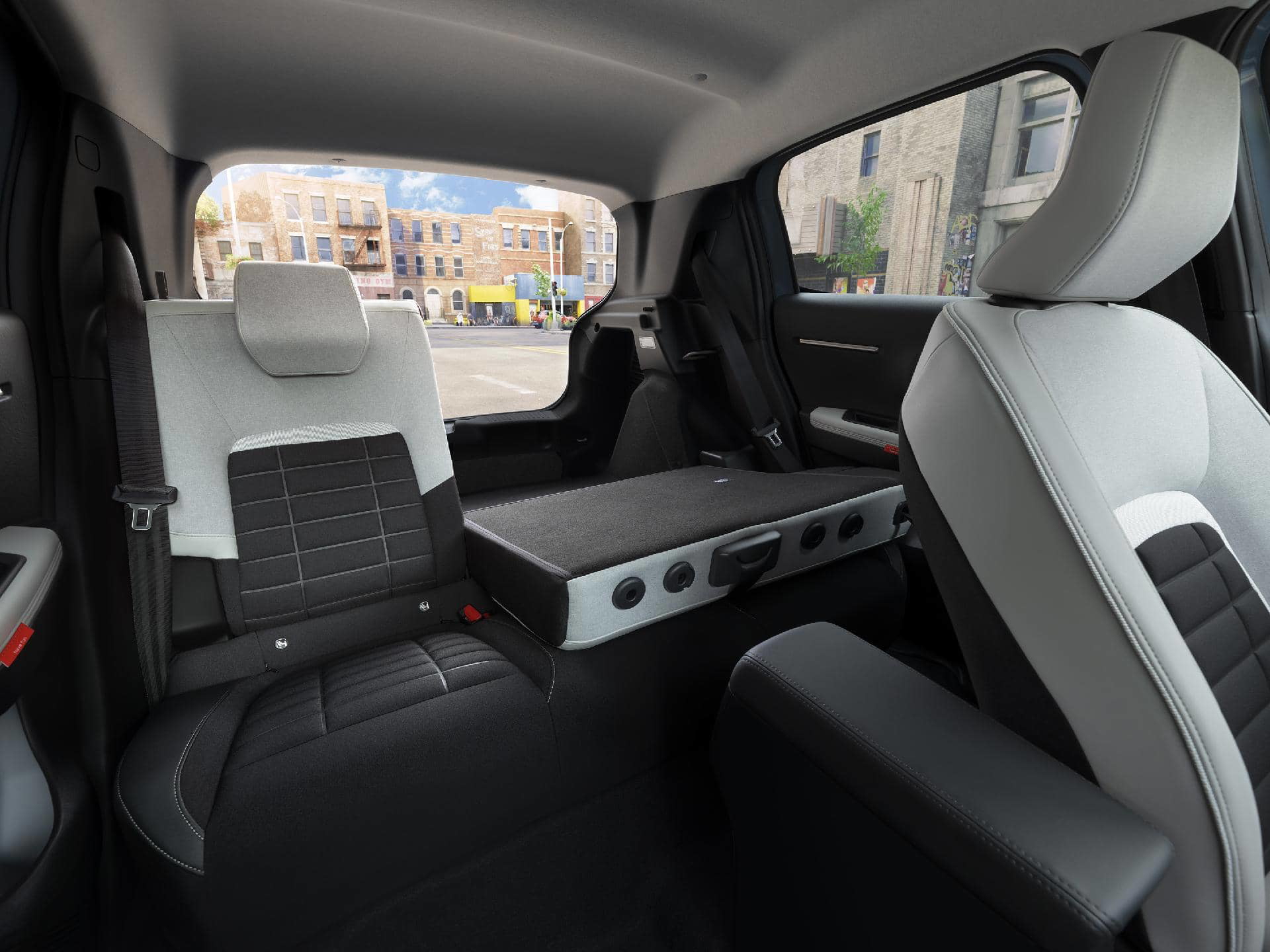 Vista lateral de los asientos traseros del Citroën C3, mostrando espacio y diseño.