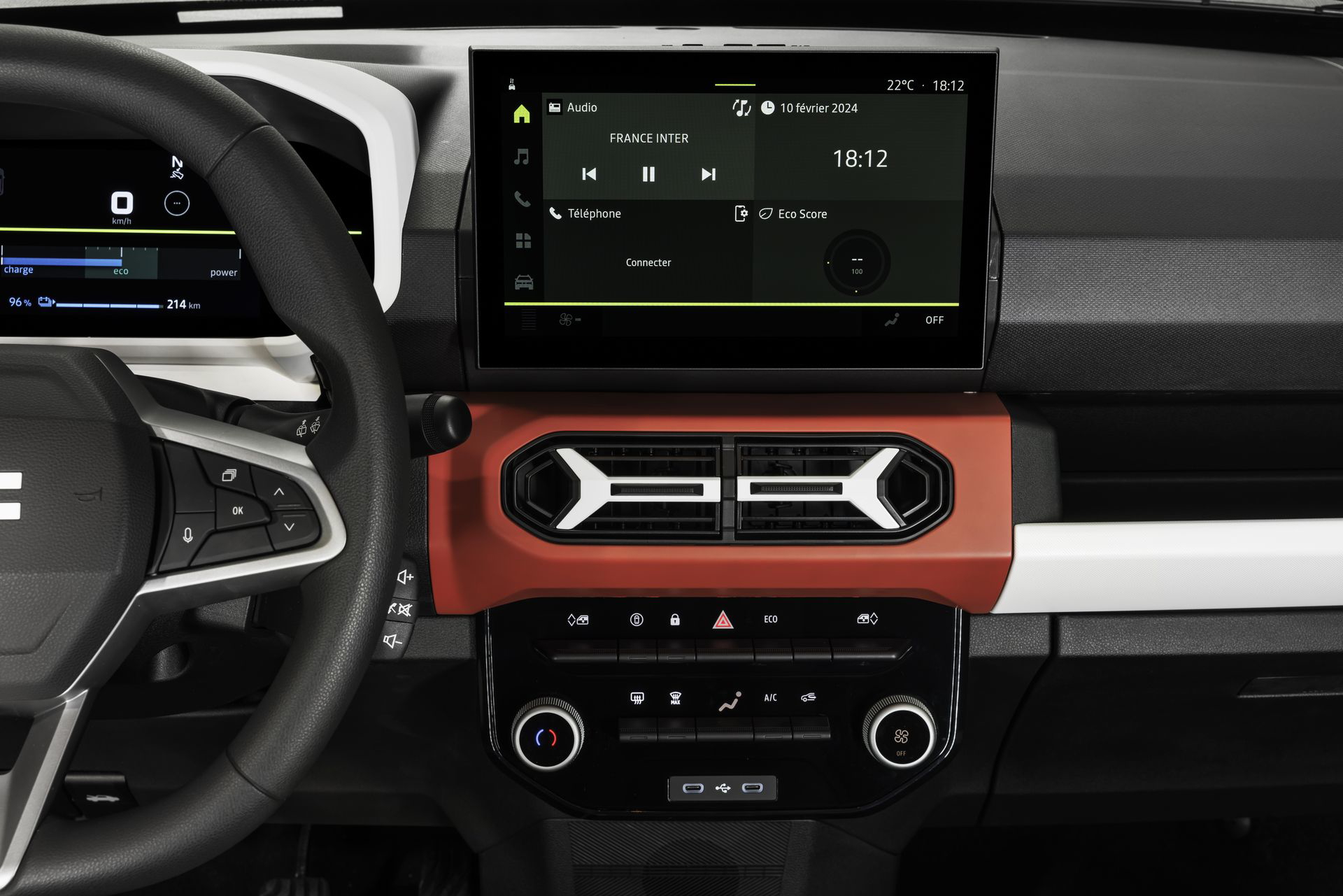 Vista del sistema de infotainment y controles de climatización del Dacia Spring.