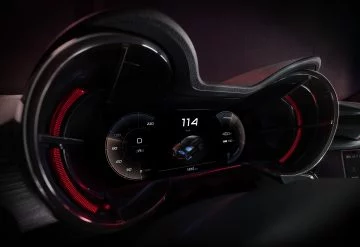 Vista del cuadro de instrumentos Alfa Romeo con iluminación roja y velocidad marcada a 174 km/h.