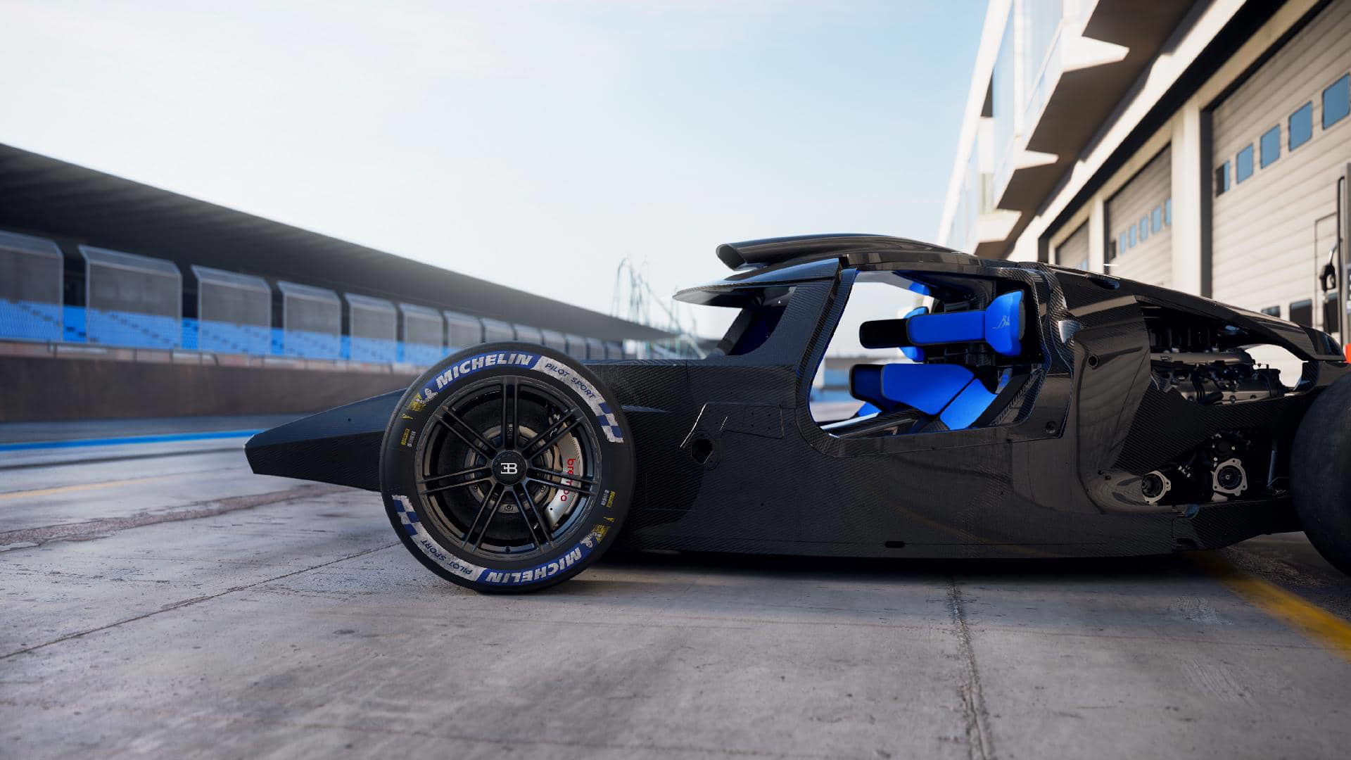 Vista lateral de un Bugatti preparado para competir en Le Mans con neumáticos Michelin.
