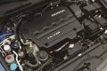 Motor Honda Civic bien conservado, con visión clara de sus componentes.