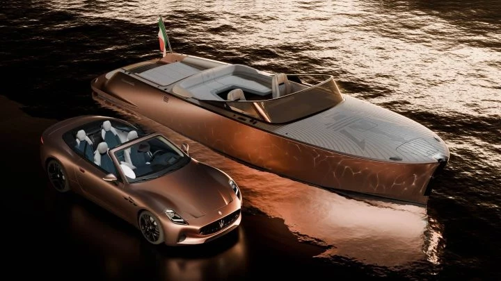 Maserati junto a un yate, reflejando exclusividad y diseño.