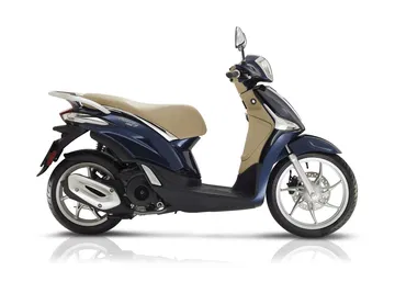 Vista lateral del Piaggio Liberty destacando su diseño compacto y urbano.