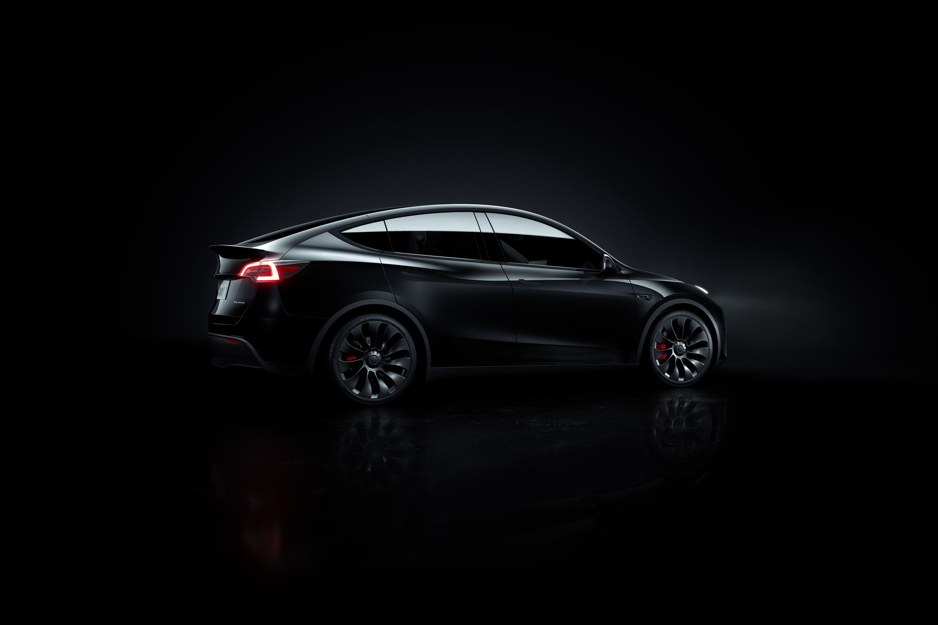 Vista lateral del Tesla Model Y 2024, mostrando su diseño aerodinámico y líneas modernas.