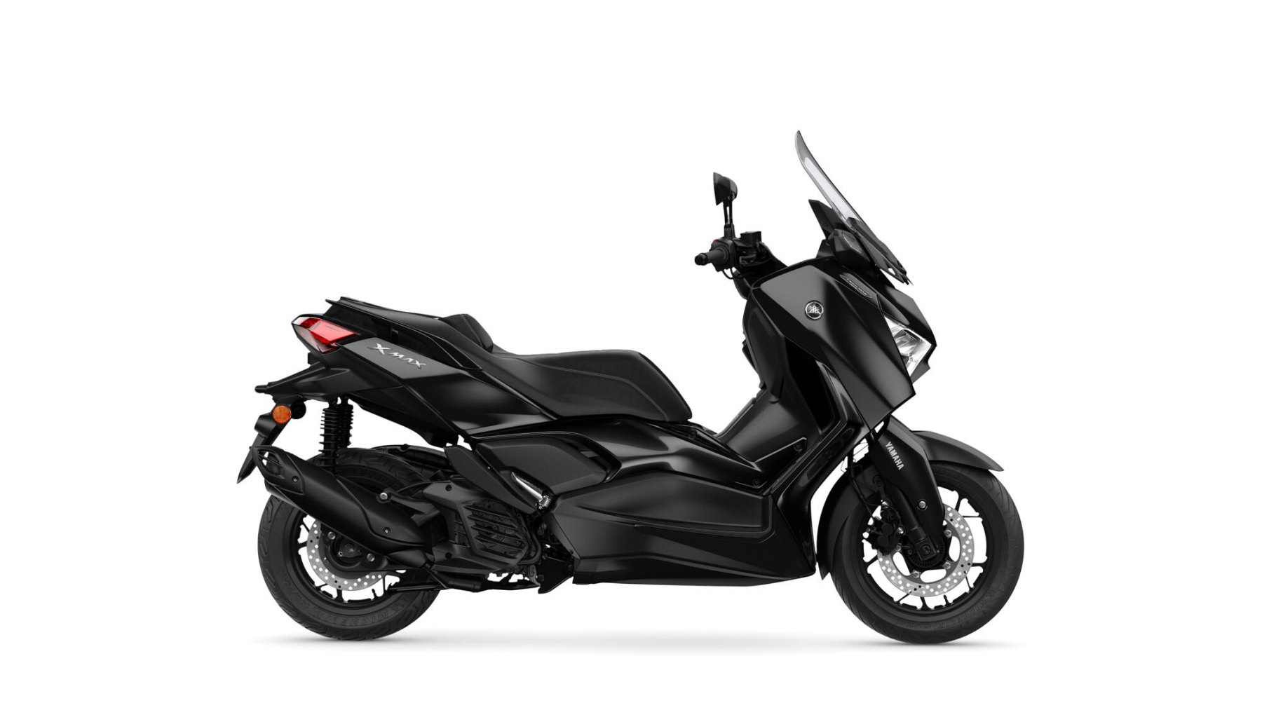 Vista lateral Yamaha X-Max 125cc, destacando su diseño aerodinámico y elegante. Vista lateral Yamaha X-Max 125cc, destacando su diseño aerodinámico y elegante.