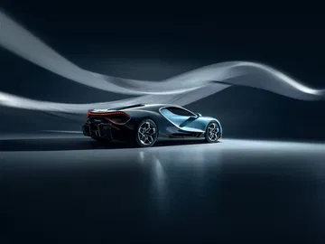 Vista frontal y lateral del Bugatti Tourbillon, una muestra de poderío y diseño vanguardista. Vista frontal y lateral del Bugatti Tourbillon, una muestra de poderío y diseño vanguardista.