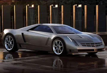 Vista lateral del Cadillac Cien 2002, destacando su aerodinámica y diseño agresivo. Vista lateral del Cadillac Cien 2002, destacando su aerodinámica y diseño agresivo.