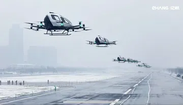 Innovador taxi aéreo autónomo sobrevuela el paisaje urbano.