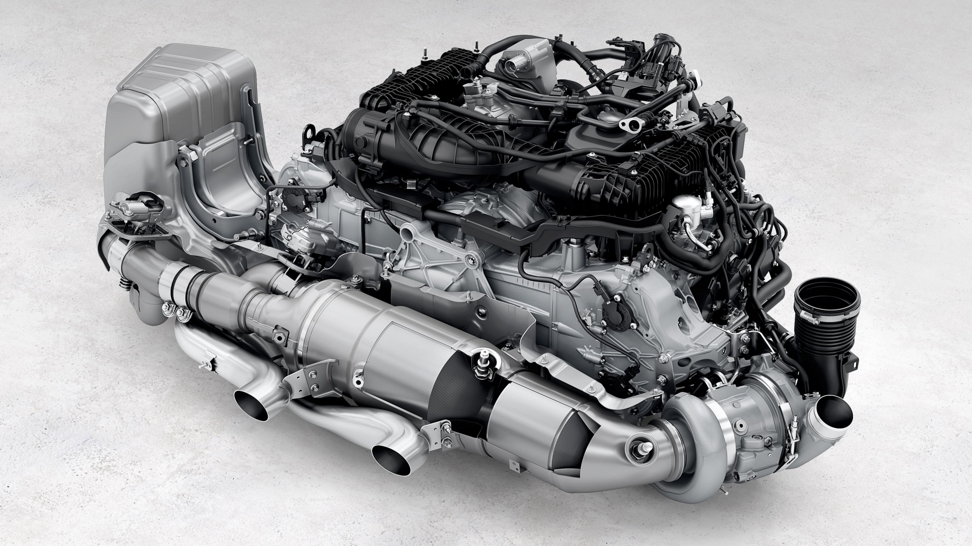 Vista del propulsor Porsche 911 GTS T-Hybrid, fusión de potencia y eficiencia.