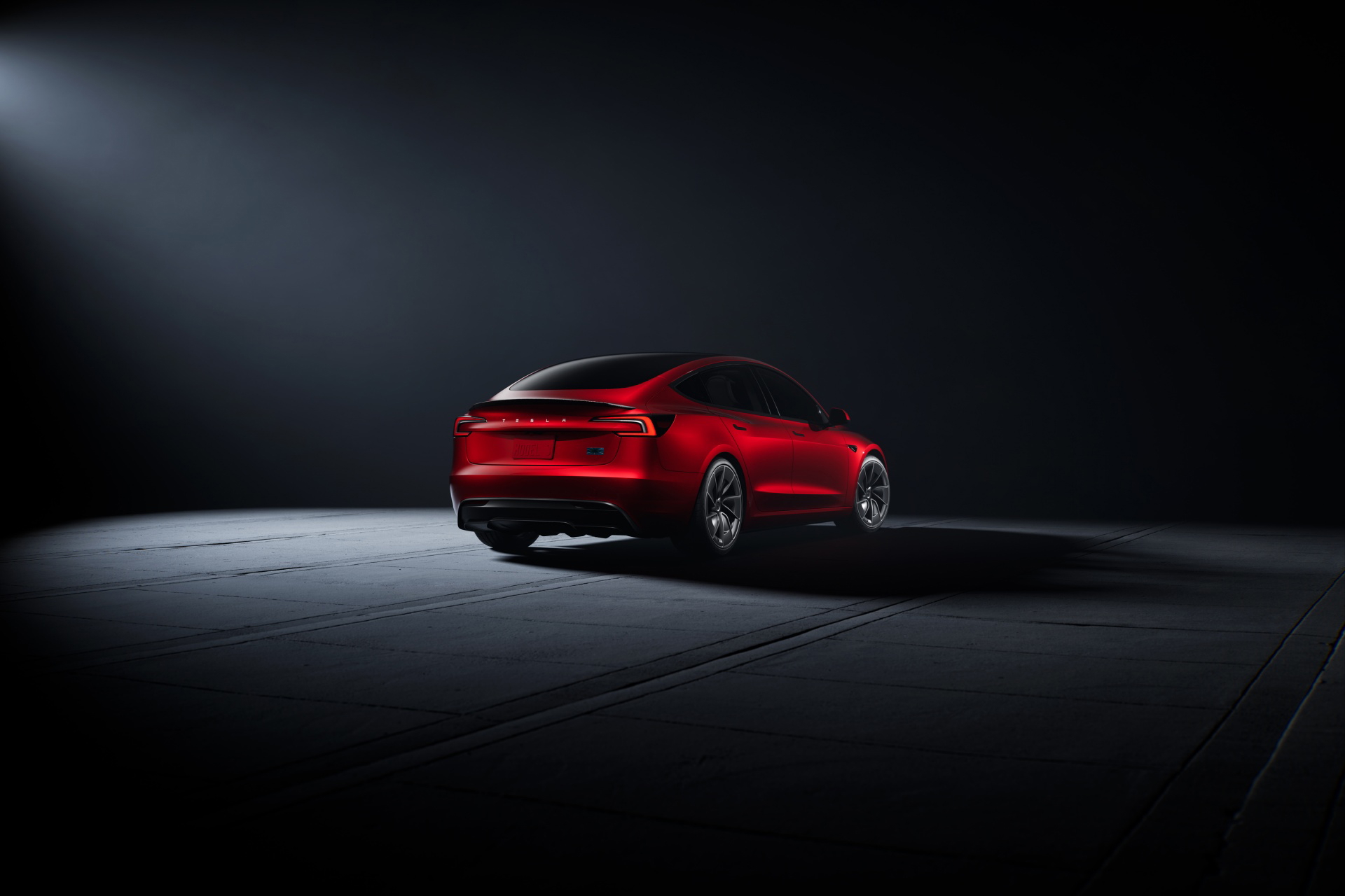 Vista trasera que enfatiza la silueta deportiva del Model 3 Performance.