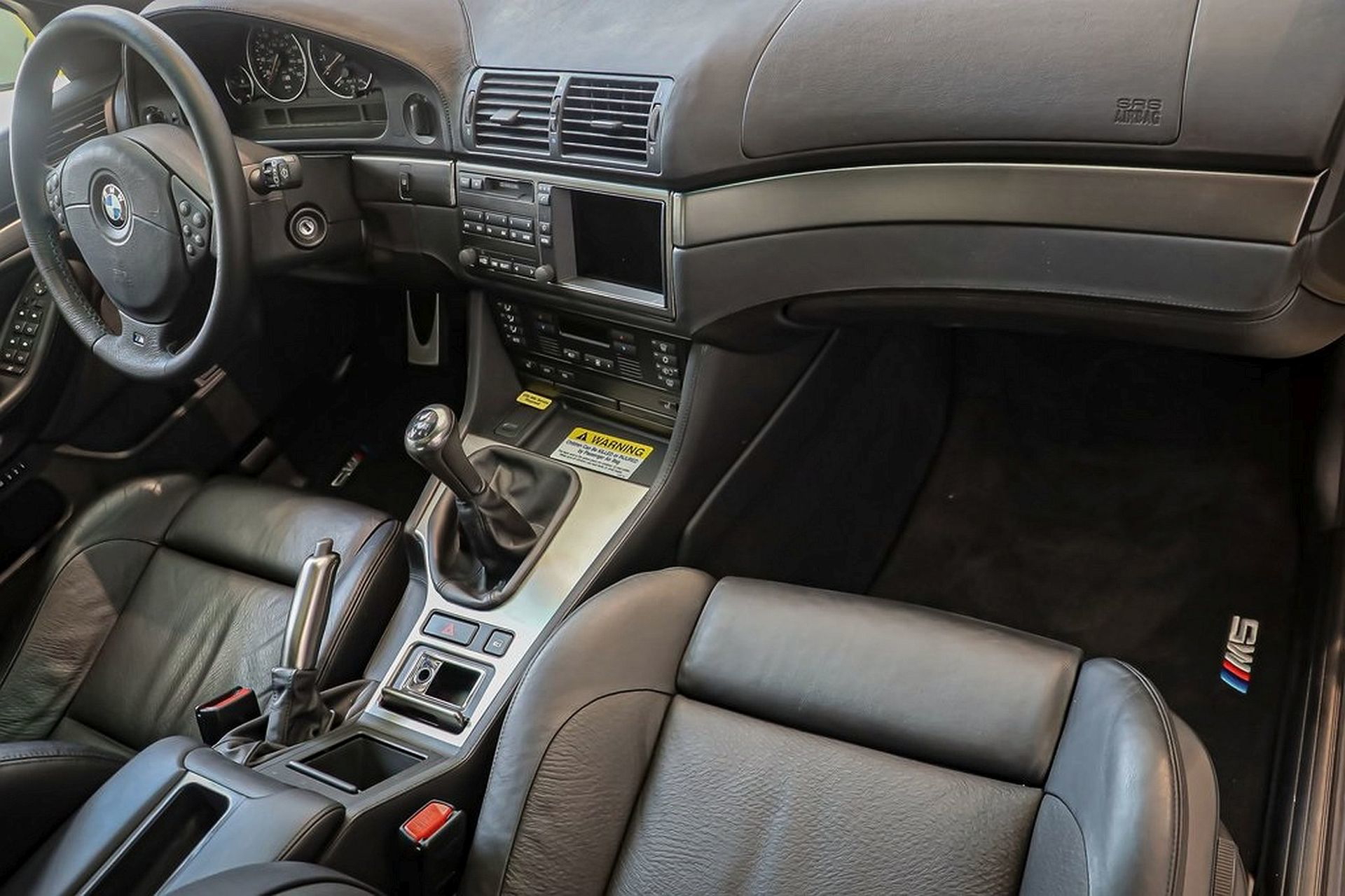 Impecable habitáculo con asientos de piel y acabados premium, BMW M5 E39.