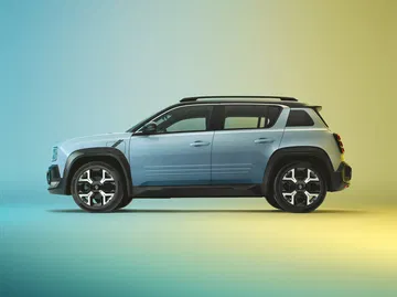 Vista lateral del nuevo Renault 4, mostrando su diseño SUV compacto y moderno.