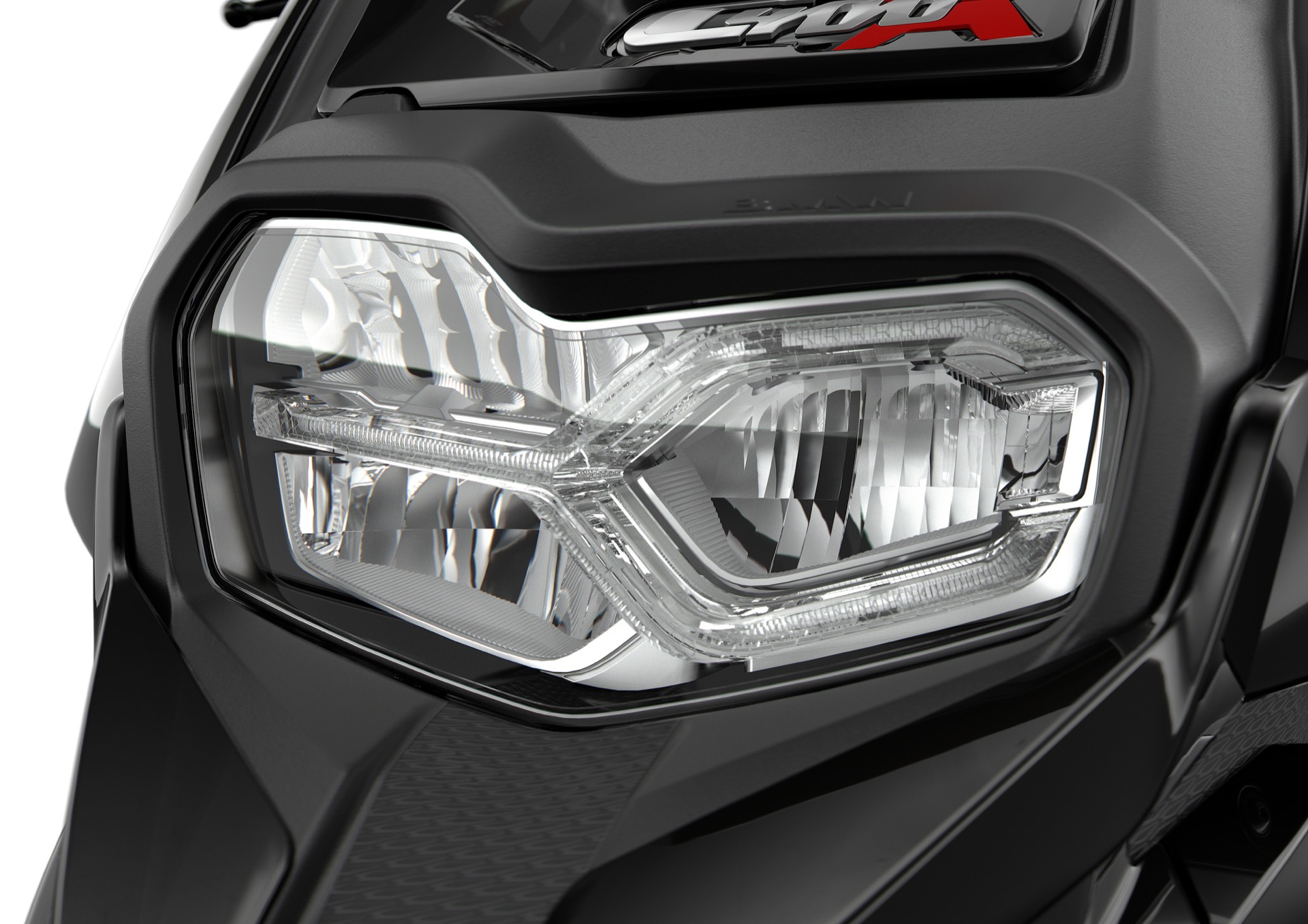 Primer plano del faro BMW C 400 X, diseño y tecnología alemana.