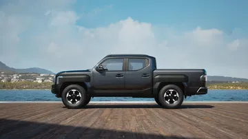 Vista dinámica lateral de la nueva pickup Kia Tasman 2025.