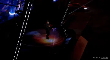 Visión parcial e iluminada de nuevo Tesla Cybercab en su presentación.