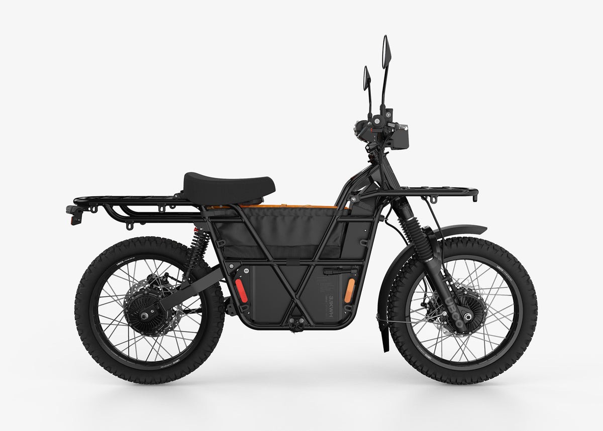 Vista lateral de la UBCO 2X2, una motocicleta eléctrica versátil y robusta.