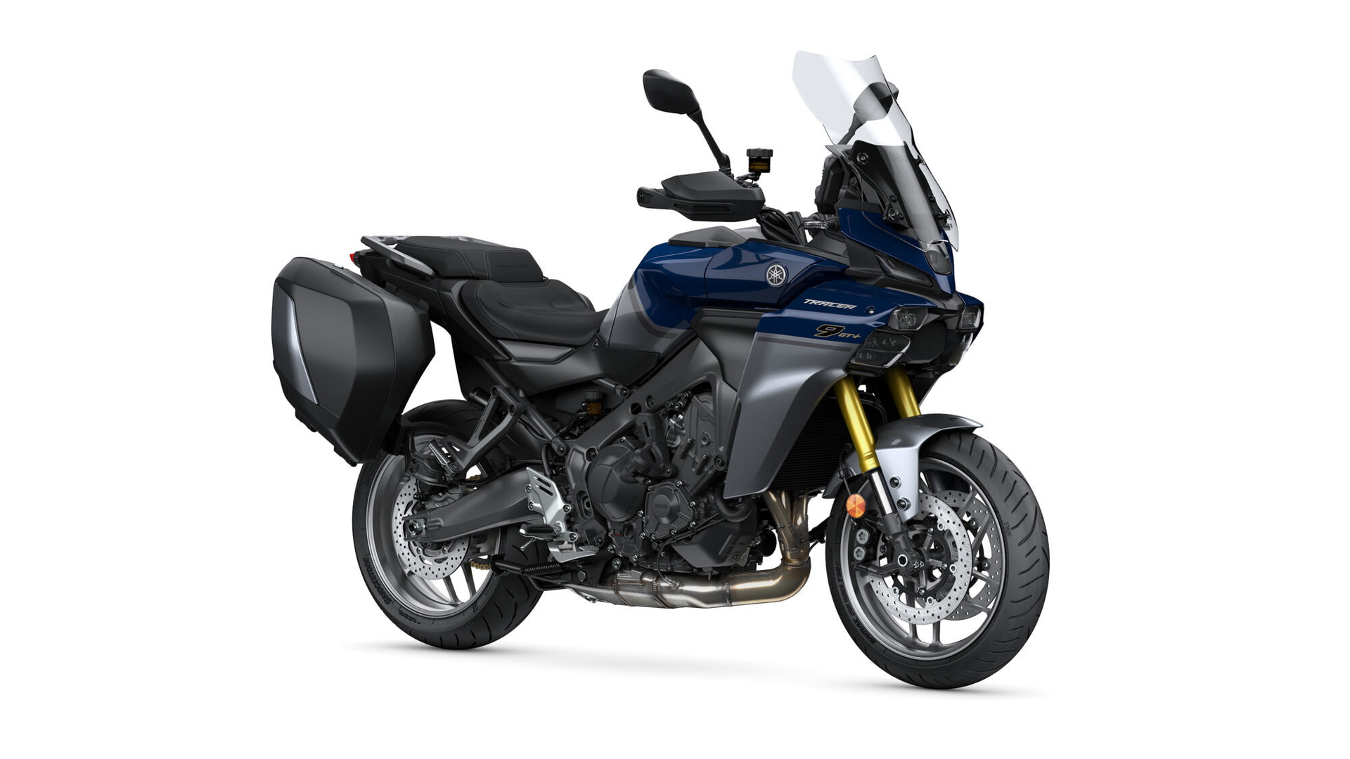 Vista lateral de Yamaha Tracer 9 con diseño aerodinámico y maletas integradas.