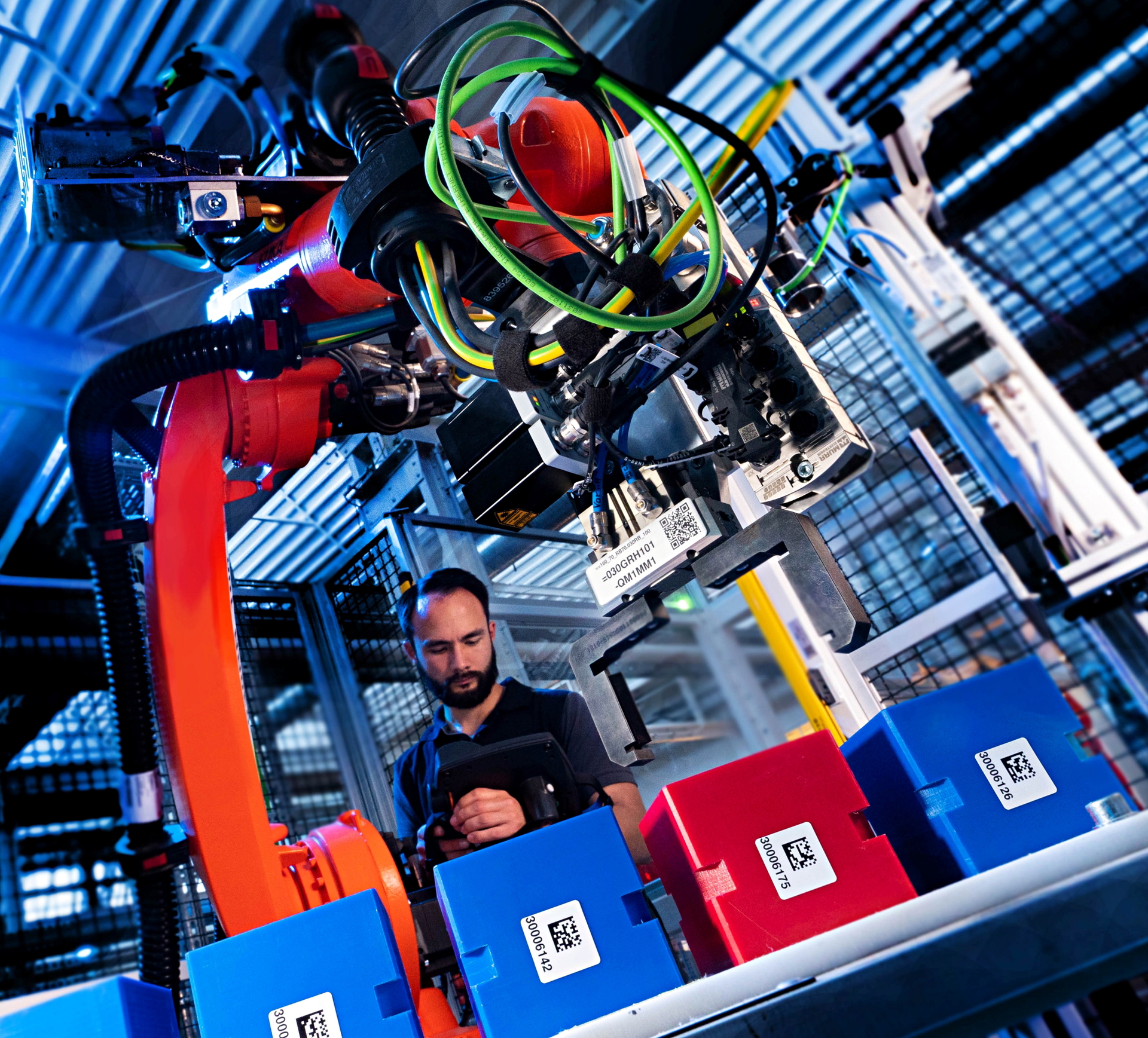 Imagen del proceso de ensamblaje automatizado en la producción de automóviles.