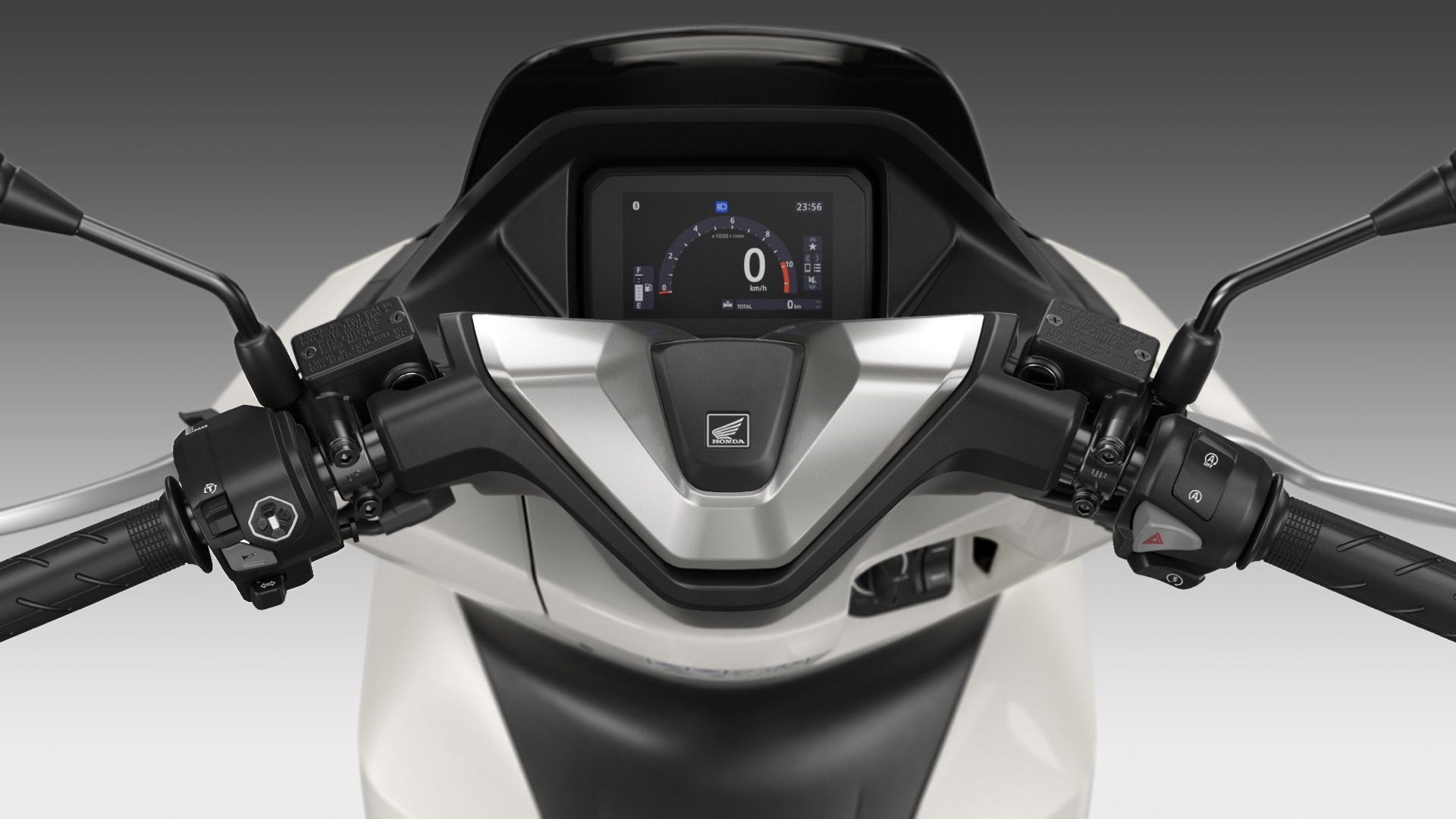 Vista cercana del panel de instrumentos del renovado Honda PCX 125.