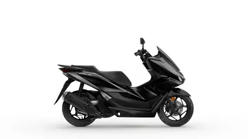 Vista lateral del scooter Honda PCX 125, destacando su diseño práctico y moderno.