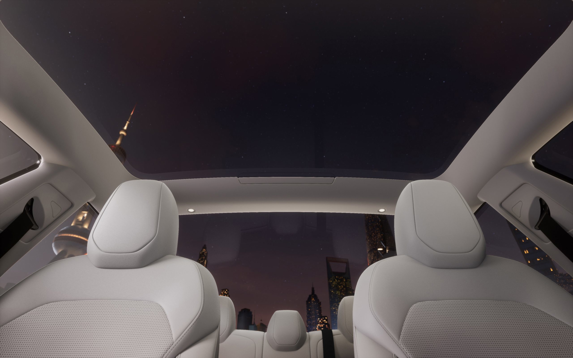 Vista del interior del Tesla Model 3, mostrando su techo panorámico y asientos cómodos.