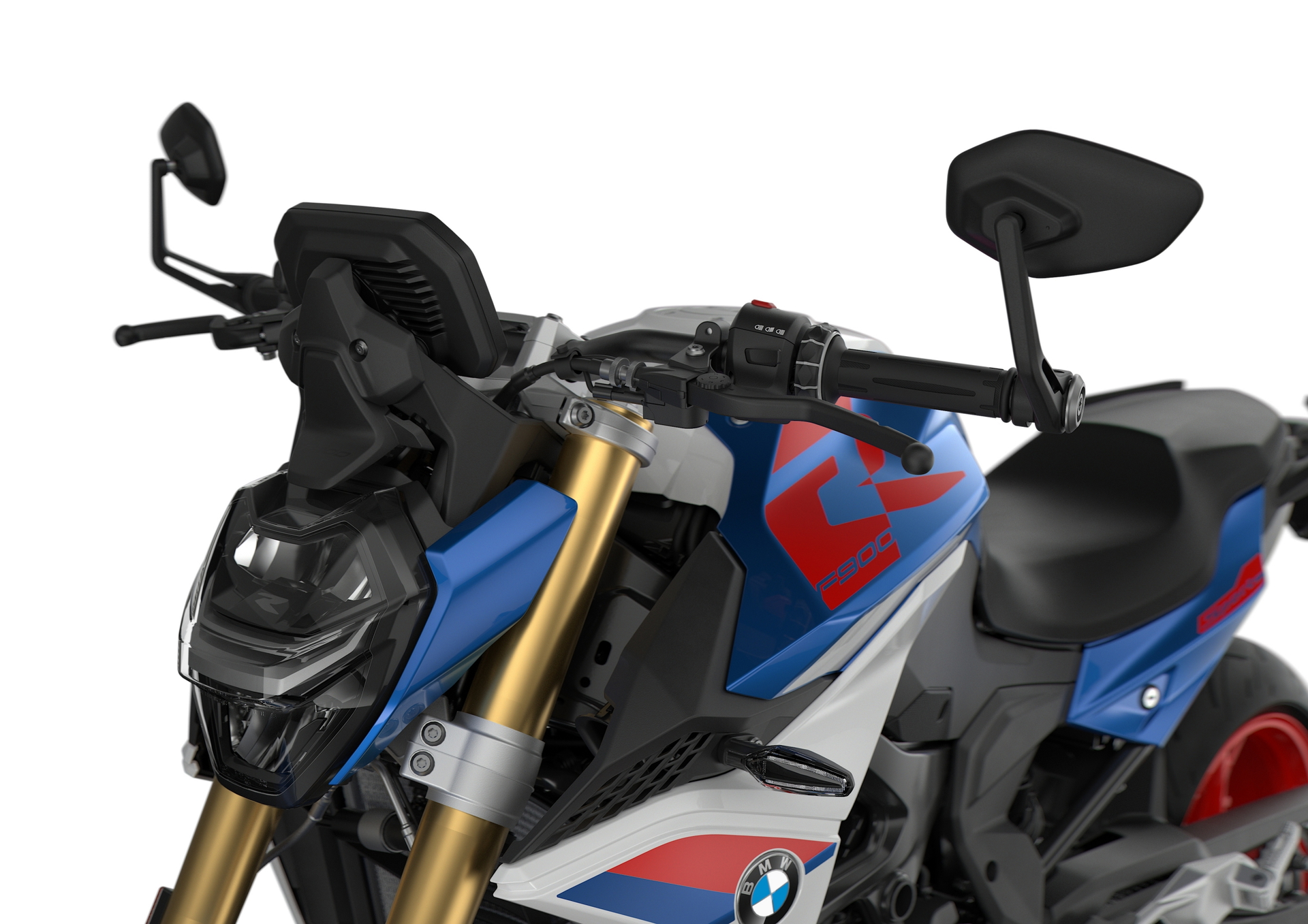 Vista lateral del BMW F 900 R, mostrando su diseño moderno y agresivo.