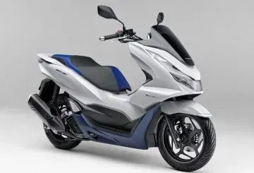 Scooter Honda PCX 125 híbrido con motor eficiente y estilo moderno. Scooter Honda PCX 125 híbrido con motor eficiente y estilo moderno.